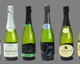 Varias botellas de cava, algunas de ellas de cava mas caro, como Grand Astoria y Canals & Nubiola, con etiquetas de diferentes marcas y tipos.