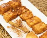 Deliciosa leche frita, receta de la abuela, espolvoreada con canela y azúcar.